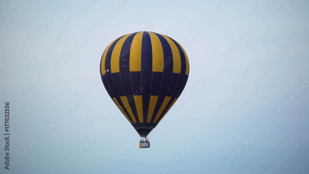 Colorful hot air balloon flying in the sky, freedom and extreme sport, hobby Colorful hot air balloon flying in the sky, freedom and extreme sport, hobby