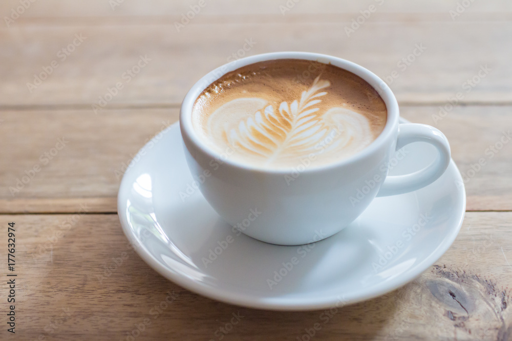 Coffee in a cup on a wooden table horizontal Coffee in a cup on a wooden table horizontal