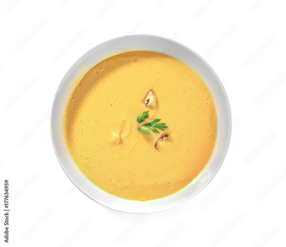 Portion of fresh homemade lentils cream soup in plate on white background Portion of fresh homemade lentils cream soup in plate on white background