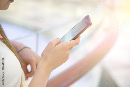 Girl woman hold smartphone phone type chat message in messenger social net web internet connection