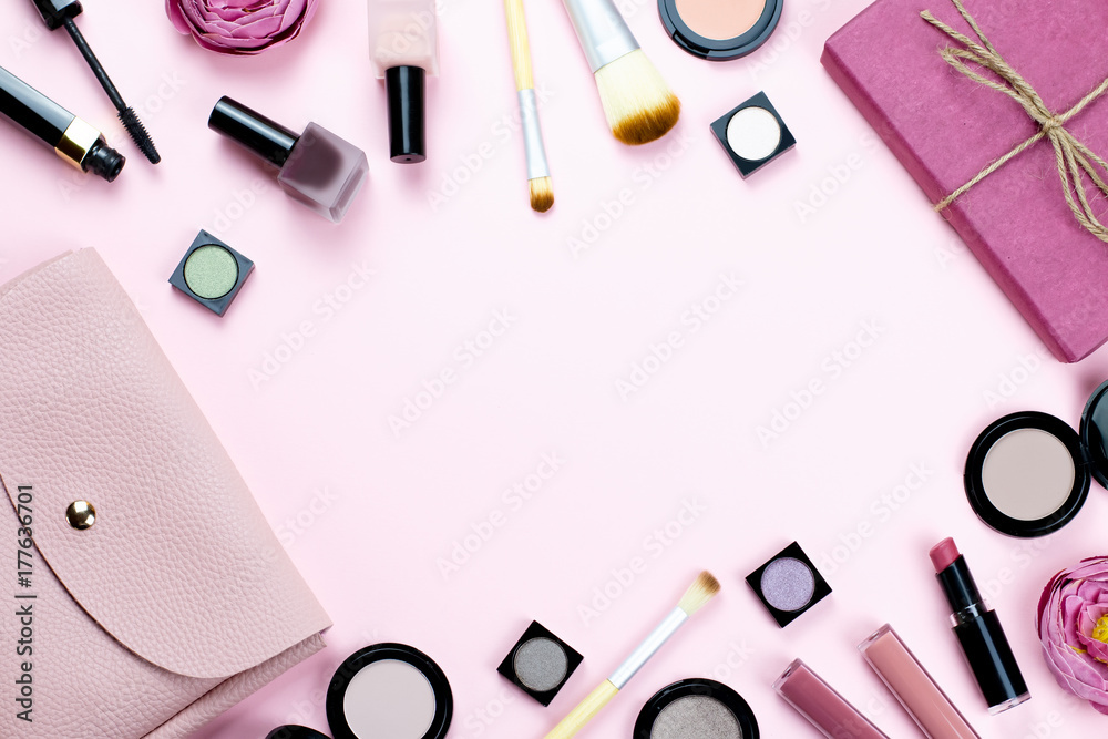 Naklejka premium Woman make up products and accessories on pastel background