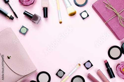 Woman make up products and accessories on pastel background