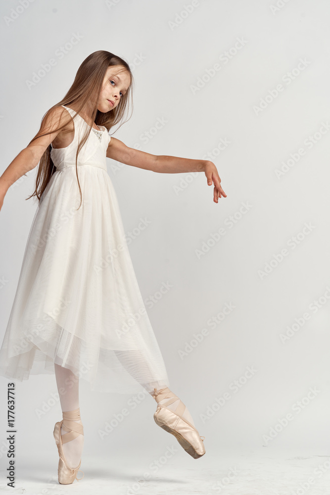 1723576 ballerina little dancing in full growth on a light background studio, ballet 1723576 ballerina little dancing in full growth on a light background studio, ballet