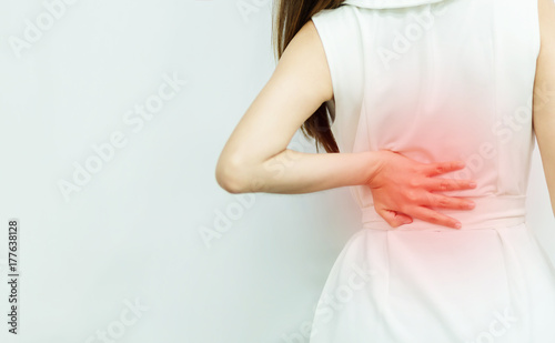Wallpaper Mural A woman in white dress feeling pain on his back. Office syndrome. Back pain from work. Herniated nucleus pulposus. spine pain. spinal degeneration. Torontodigital.ca