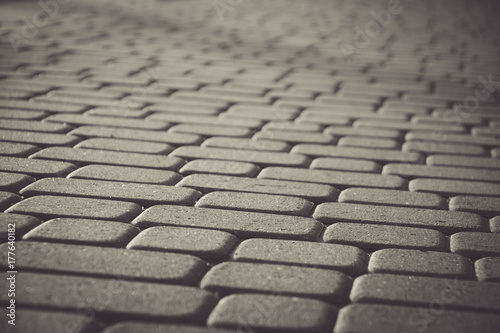 patterned paving tiles, cement brick floor background.