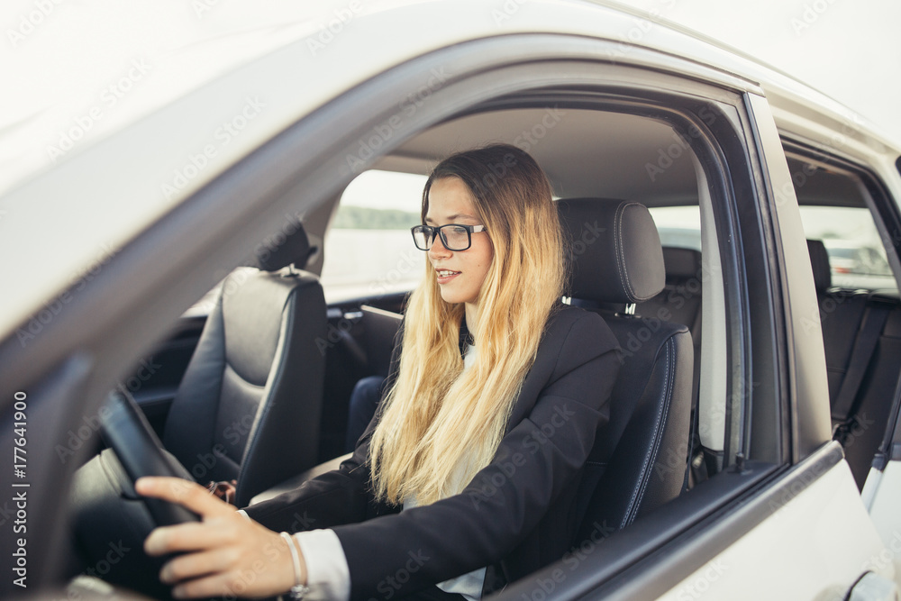 transportation and vehicle concept - close up of businesswoman driving car