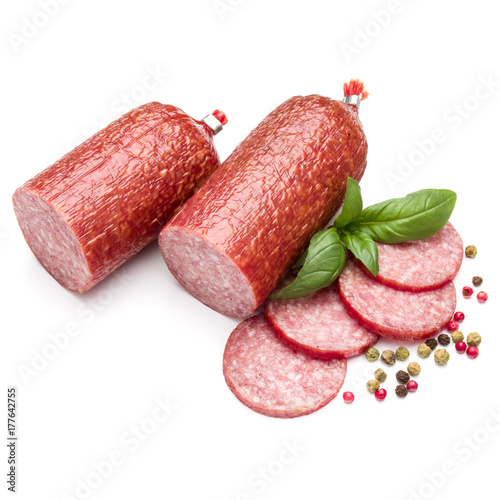 Salami smoked sausage, basil leaves and peppercorns isolated on white background cutout