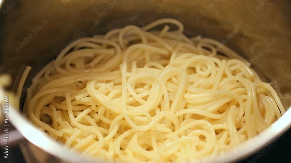 Lifting pasta out of pan Lifting pasta out of pan