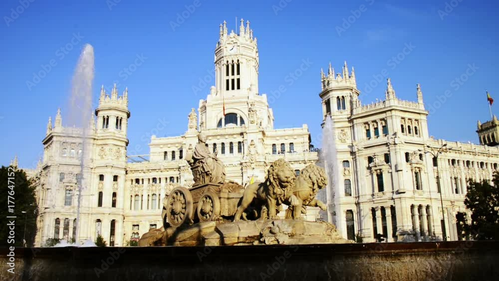 Madrid, Spain. Cybele Palace and fountain at the Plaza Cibeles in Madrid, Spain. Famous landmark in the evening with clear blue sky at the background Madrid, Spain. Cybele Palace and fountain at the Plaza Cibeles in Madrid, Spain. Famous landmark in the evening with clear blue sky at the background