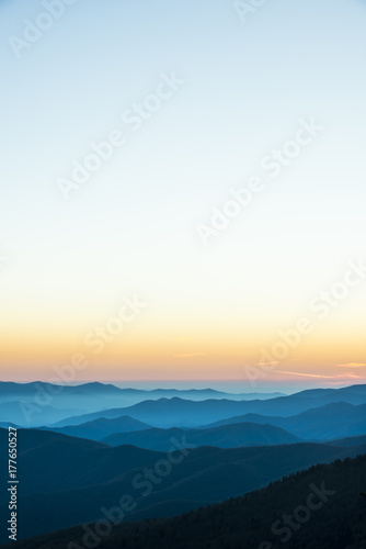 Glorious Sunrise over the Great Smoky Mountains layered blue ridges to the orange yellow horizon