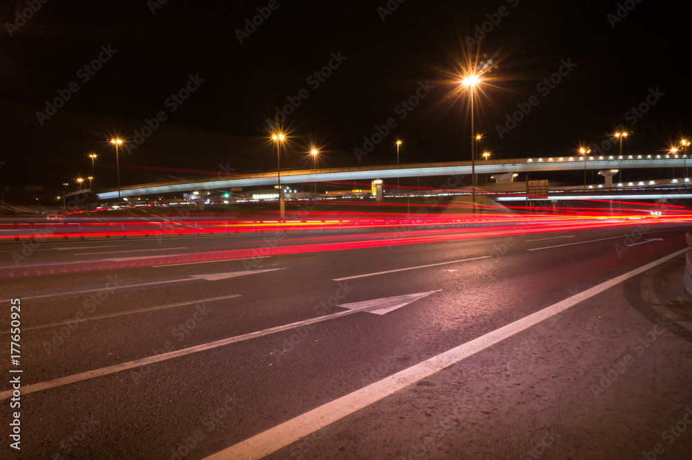 the light trails on the modern building background in moscow russia the light trails on the modern building background in moscow russia