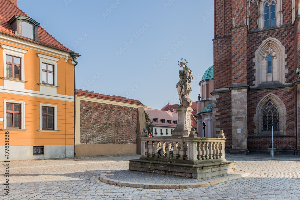 Sandstone statue of Virgin Mary with baby Jesus in front (1854) of the Cathedral of St. John the Baptist on the Cathedral Island in Wroclaw, Lower Silesia, Poland