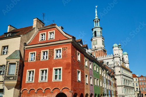 townhouses on the old market with Renaissance town hall tower in Poznan.