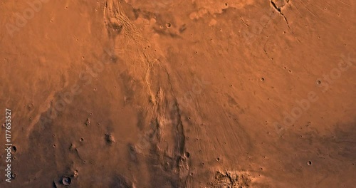 Very high altitude aerial flyover of Mars' eastern Phoenicis region. No HUD. Clip is reversible and can be rotated 180 degrees. Data: NASA/JPL/USGS photo