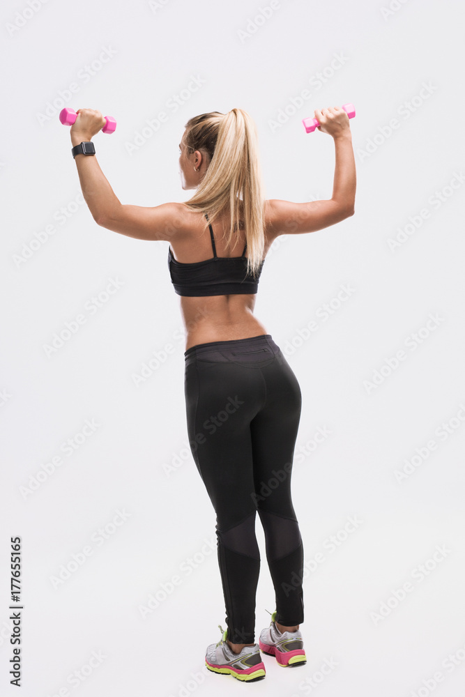 Young woman doing back exercise Young woman doing back exercise