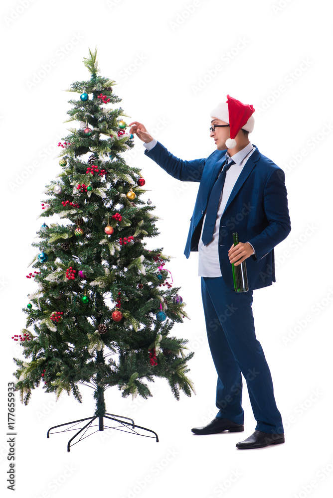 Businessman decorating christmas tree isolated on white Businessman decorating christmas tree isolated on white