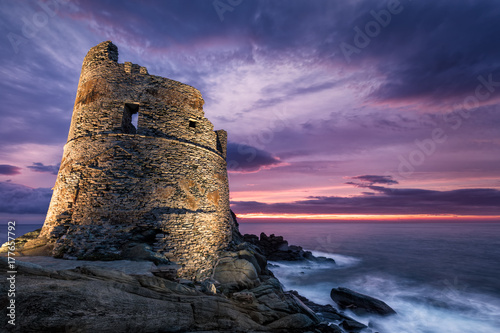 Floodlit Genoese tower at Erbalunga in Corsica at sunrise