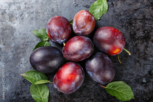 ripe plums are scattered
