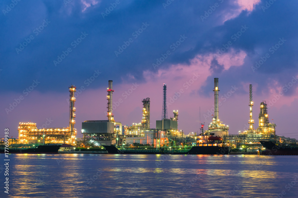 Oil refinery plant and shipping loading dock at twilight scene, Oil and Gas industry