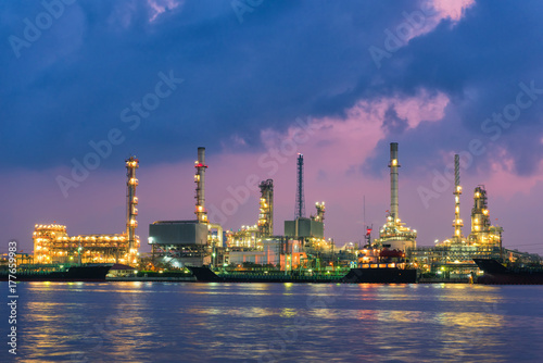 Oil refinery plant and shipping loading dock at twilight scene, Oil and Gas industry
