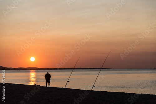 fisherman in the early morning at the beach