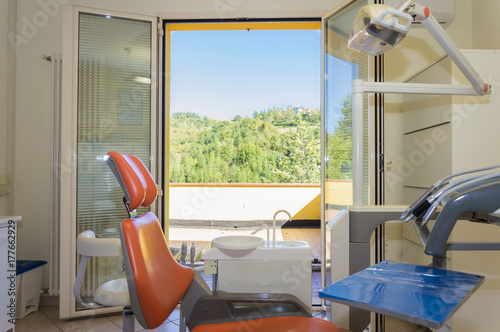 Modern dental practice. Dental chair and other accessories used by dentists