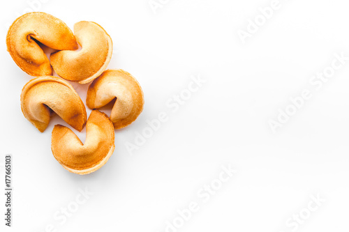 Chinese fortune cookie with prediction on white background top view mock up