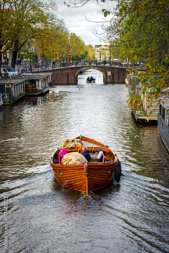 Photography wooden boat in Amsterdam canal, October 12, 2017