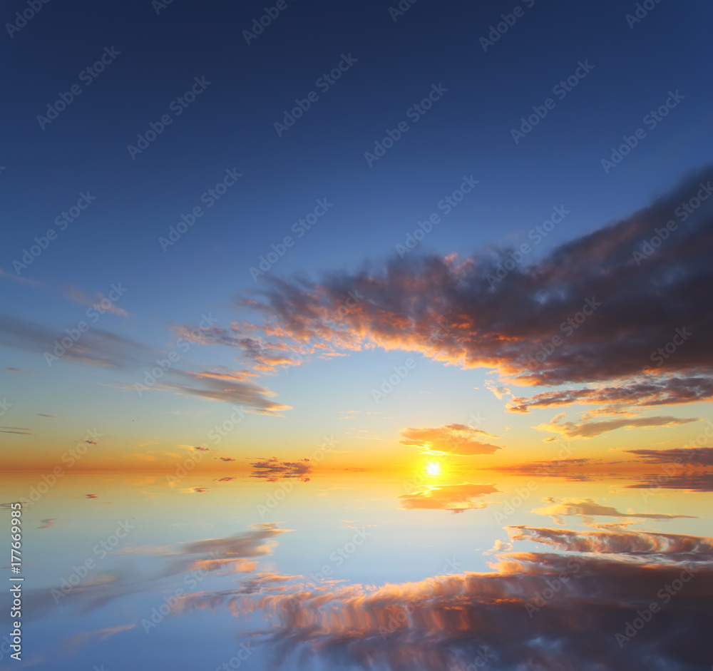 Beautiful sunset over the ocean with dramatic autumn sky. Abstract natural composition