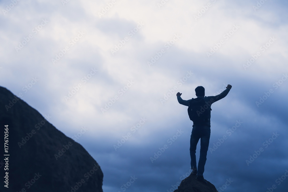 Successful man stands on a mountain. Successful man stands on a mountain.