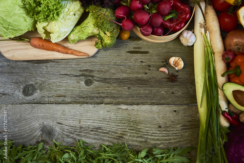 Fresh raw vegetables  on wooden background copy space for text. Design moce up photo