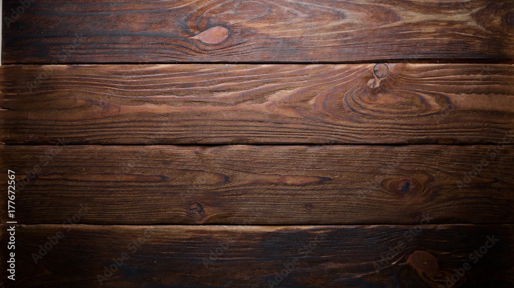 Naklejka premium Brown wooden background. Top view. Free space for your text.