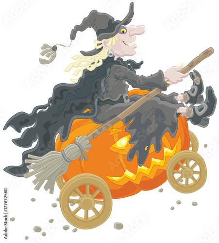 Photo Halloween witch riding on her big pumpkin