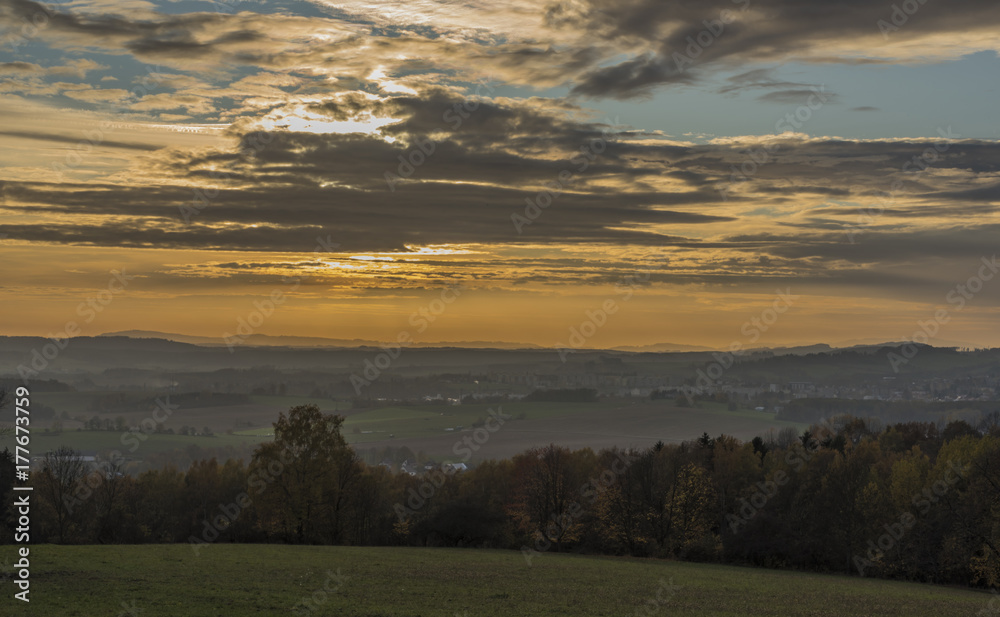 Autumn sunset with clouds in Krkonose mountains