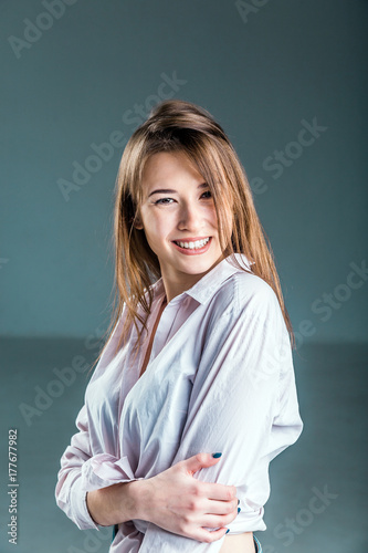 Portrait of young beautiful girl wears white scirt on isolated studio background