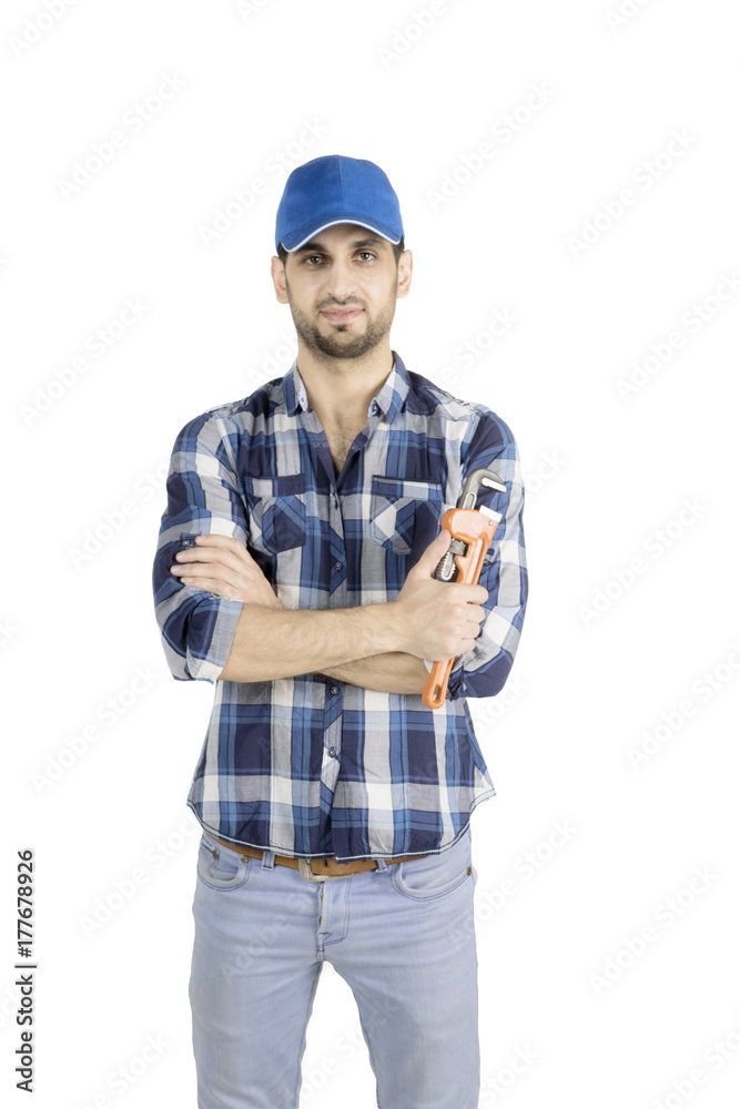 Confident Italian repairman with wrench on studio Confident Italian repairman with wrench on studio