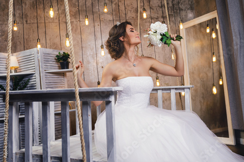 Young happy bride wearing beautiful lush dress