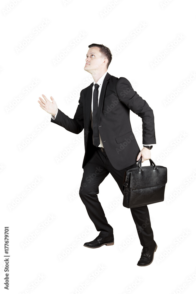 Caucasian businessman posing to step upward Caucasian businessman posing to step upward