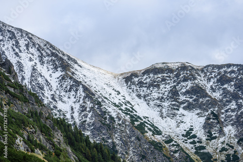 panoramic view of Tatra mountains in Slovakia covered with snow and hiding in mist © Martins Vanags