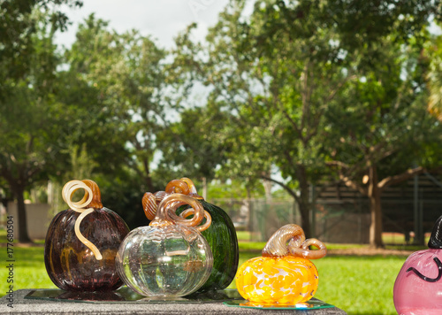 Vászonkép Hand blown colored glass pumpkins on display and for sale at an autumn art festi