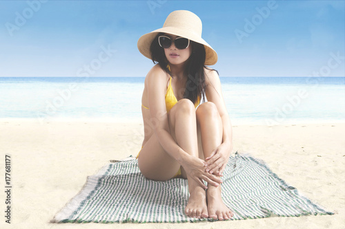 Beautiful woman resting on the beach