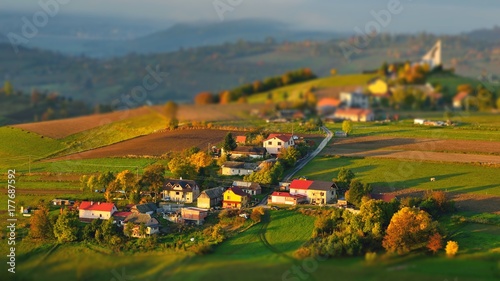 Fall landscape in Slovakia. Rural countryside in Polana region. Fields and meadows with autumn trees in Hrinova at sunrise. photo