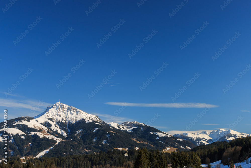 The mountain “Kitzbüheler Horn” in front of a blue sky The mountain “Kitzbüheler Horn” in front of a blue sky