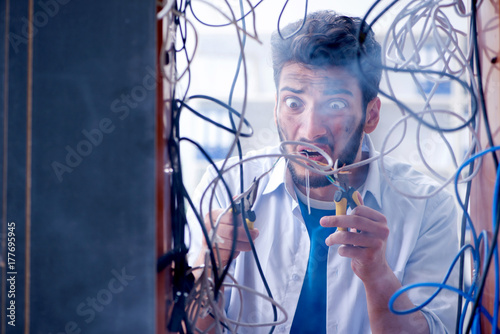 Electrician trying to untangle wires in repair concept