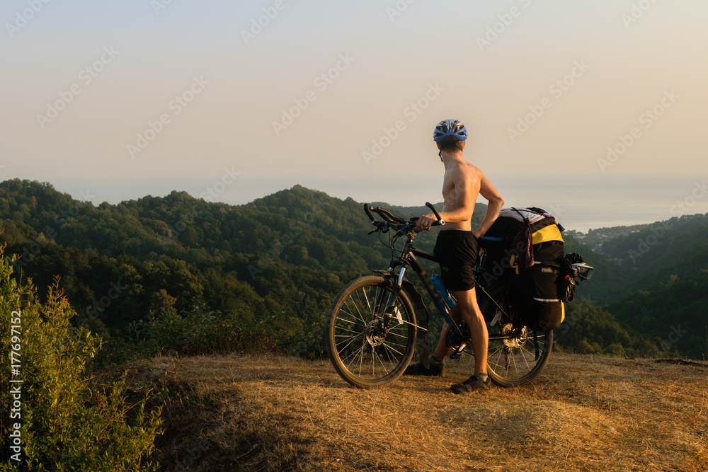 Bicyclist in mountains in Abkhazia
