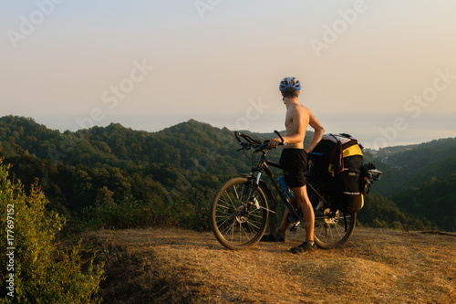 Fototapeta Naklejka Na Ścianę i Meble -  Bicyclist in mountains in Abkhazia