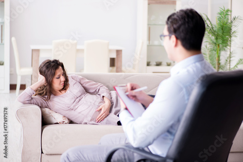 Pregnant woman visiting psychologist doctor © Elnur