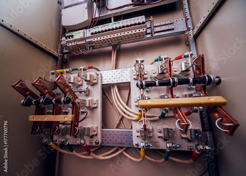 Wires and switches in electric box. Electrical panel with fuses and contactors