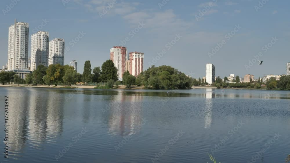 Autumn landscape, a lake on the background of a new city. 4k video Autumn landscape, a lake on the background of a new city. 4k video