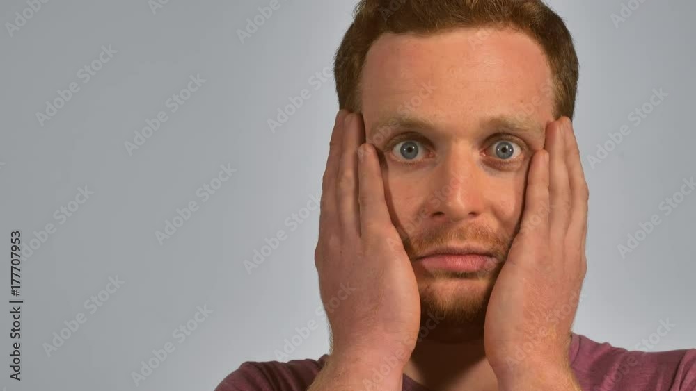 close up portrait attractive man showing emotion surprise. handsome student with red hair and blue eyes looking at the camera feeling of surprise caused by something beautiful, unexpected, unfamiliar close up portrait attractive man showing emotion surprise. handsome student with red hair and blue eyes looking at the camera feeling of surprise caused by something beautiful, unexpected, unfamiliar